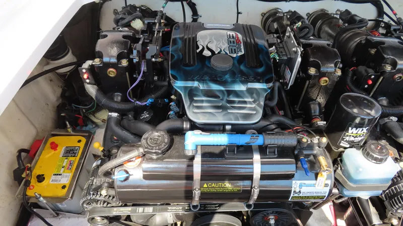 Slide: The Image of Engine compartment of a 2003 Donzi 28 ZX Open boat, showcasing detailed components. - 25