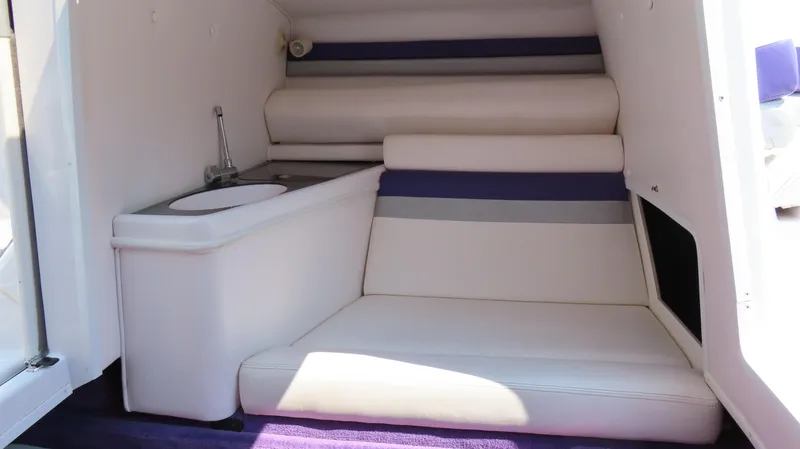 Slide: The Image of Interior of 2003 Donzi 28 ZX Open boat with seating and small sink. - 26