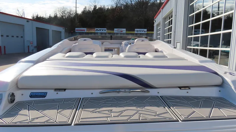 Slide: The Image of 2003 Donzi 28 ZX Open boat, rear view, showcasing seating and deck design. - 30