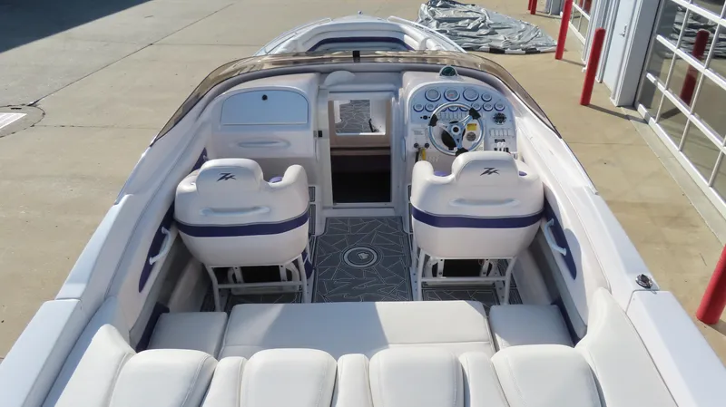 Slide: The Image of 2003 Donzi 28 ZX Open boat interior with white seating and modern dashboard. - 37