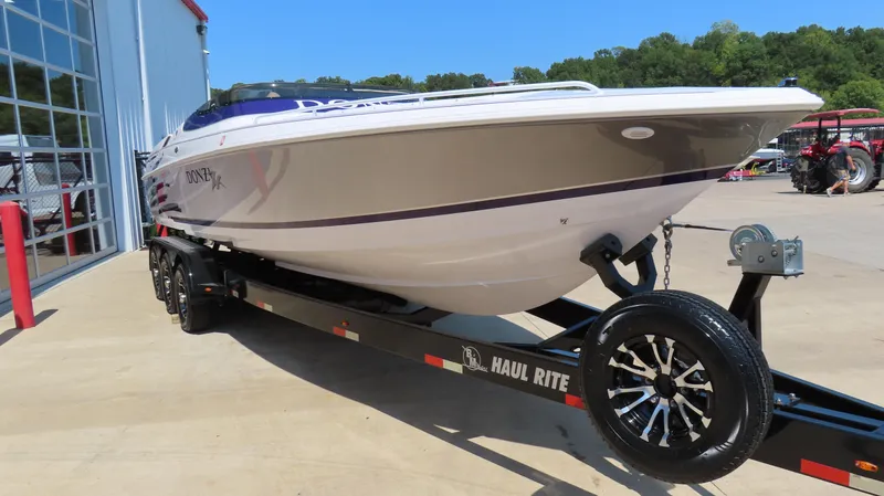 Slide: The Image of 2003 Donzi 28 ZX Open boat on Haul Rite trailer, parked outdoors. - 4