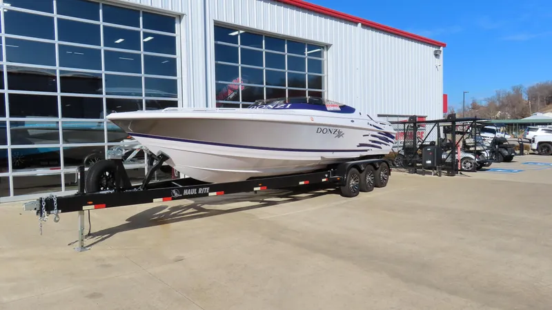 Slide: The Image of 2003 Donzi 28 ZX Open boat on trailer outside dealership. - 42