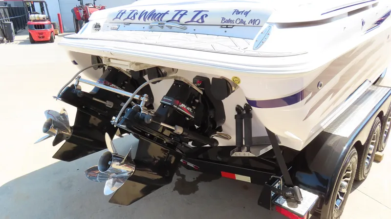 Slide: The Image of 2003 Donzi 28 ZX Open boat on trailer, dual propellers visible. - 6