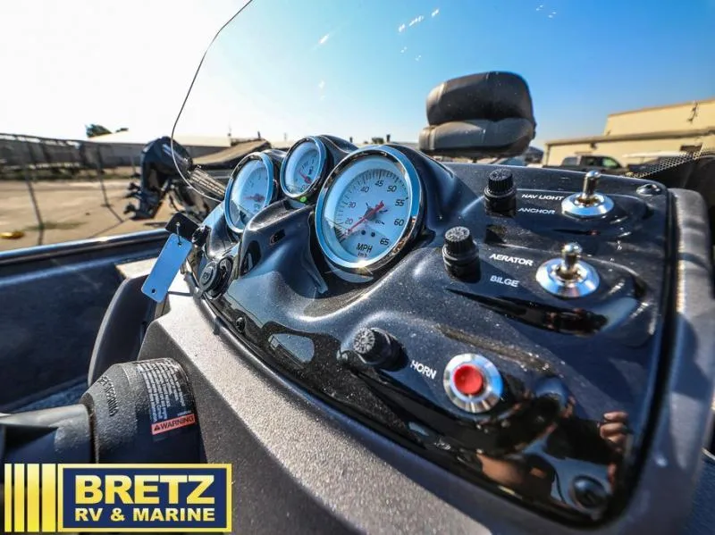 Slide: The Image of Dashboard of a 2025 Pro 170 boat with gauges and controls, Bretz RV & Marine logo. - 7