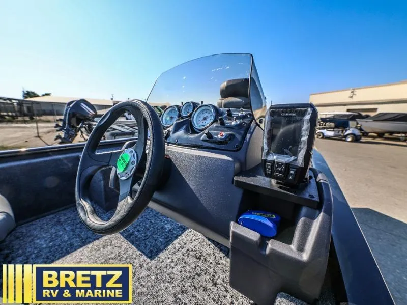 Slide: The Image of Pro 170 boat dashboard with steering wheel and Garmin device, Bretz RV & Marine logo visible. - 8