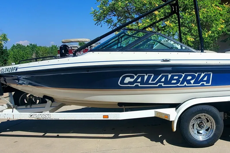 Slide: The Image of 2000 Calabria Sport Comp XTS boat on trailer, side view. - 3