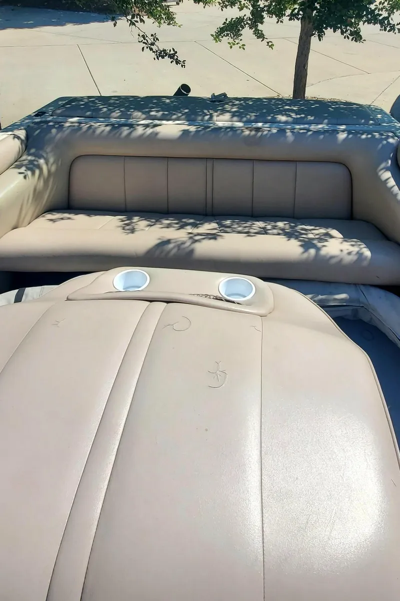 Slide: The Image of 2000 Calabria Sport Comp XTS boat interior with beige leather seating. - 7