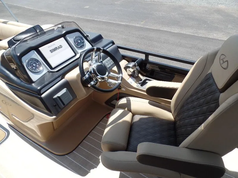 Slide: The Image of 2021 Harris Solstice 250 SL boat interior with modern dashboard and luxurious seating. - 12