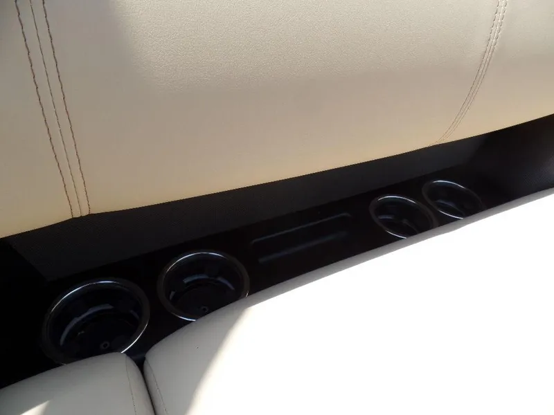 Slide: The Image of Interior of 2021 Harris Solstice 250 SL with beige seating and cup holders. - 15