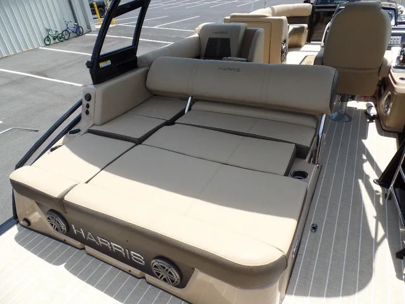 Slide: The Image of 2021 Harris Solstice 250 SL boat with beige seating and spacious deck layout. - 3