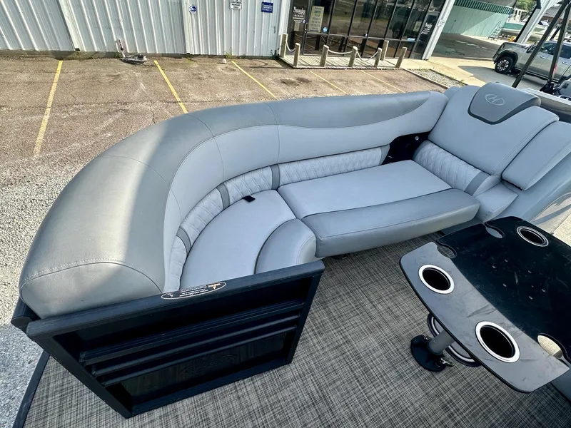 Slide: The Image of 2021 Harris Grand Mariner 250 boat interior with gray seating and cup holders. - 13