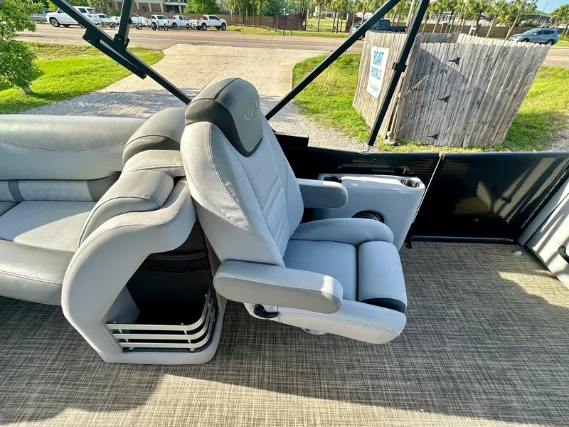 Slide: The Image of 2021 Harris Grand Mariner 250 boat interior with plush seating and modern design. - 17