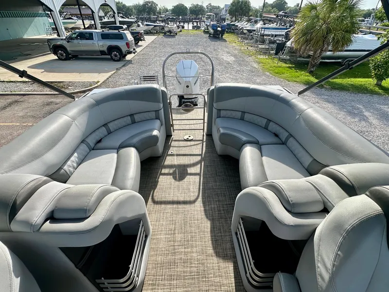 Slide: The Image of 2021 Harris Grand Mariner 250 pontoon boat with spacious seating and modern design. - 18
