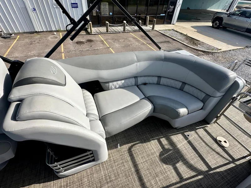 Slide: The Image of 2021 Harris Grand Mariner 250 boat with luxurious gray seating and spacious deck area. - 20