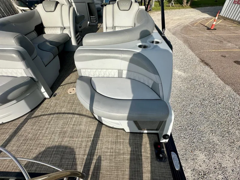 Slide: The Image of 2021 Harris Grand Mariner 250 boat interior with gray seating and cup holders. - 22