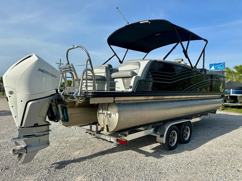 Slide: The Image of 2021 Harris Grand Mariner 250 pontoon boat on trailer with Mercury outboard motor. - 5