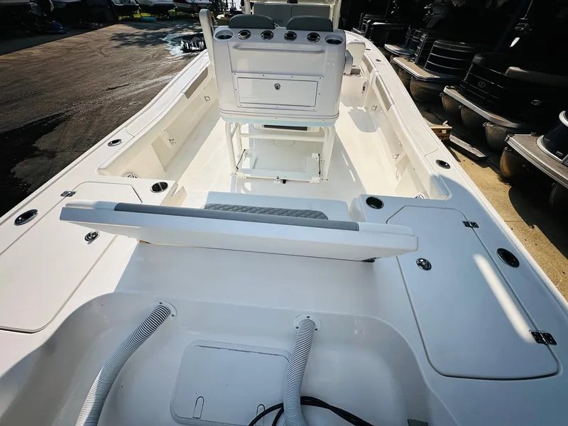 Slide: The Image of 2024 Caymas 281 HB boat interior, featuring spacious deck and modern console design. - 11