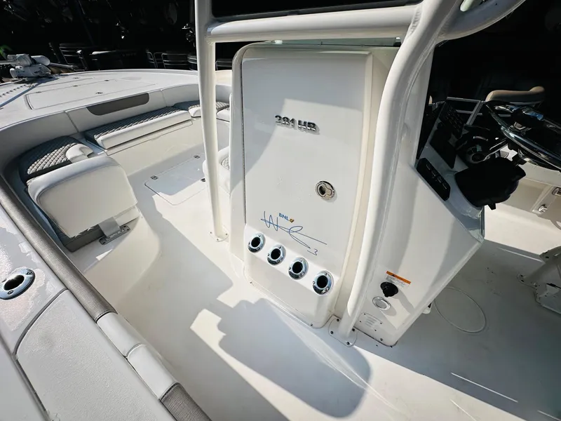 Slide: The Image of 2024 Caymas 281 HB boat interior, featuring sleek white design and modern controls. - 21