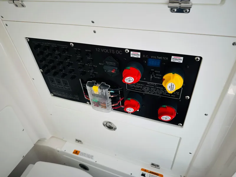 Slide: The Image of Electrical panel of 2024 Caymas 281 HB boat with switches and voltmeter. - 23
