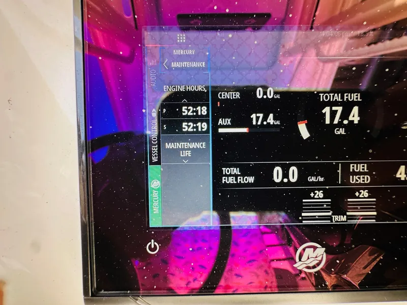 Slide: The Image of 2024 Caymas 281 HB dashboard display showing engine hours and fuel levels. - 24