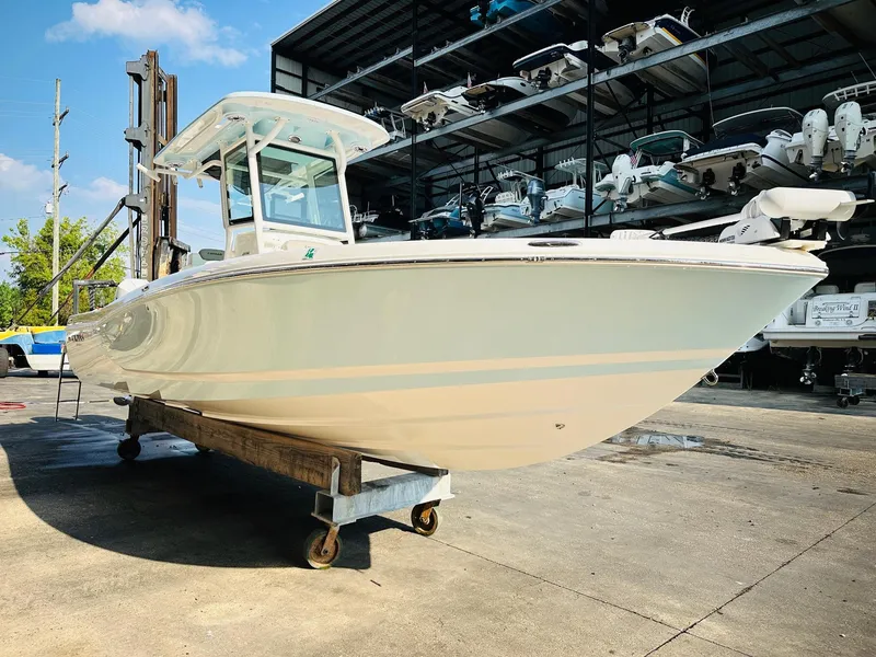 Slide: The Image of 2024 Caymas 281 HB boat in a marina, showcasing sleek design and modern features. - 3