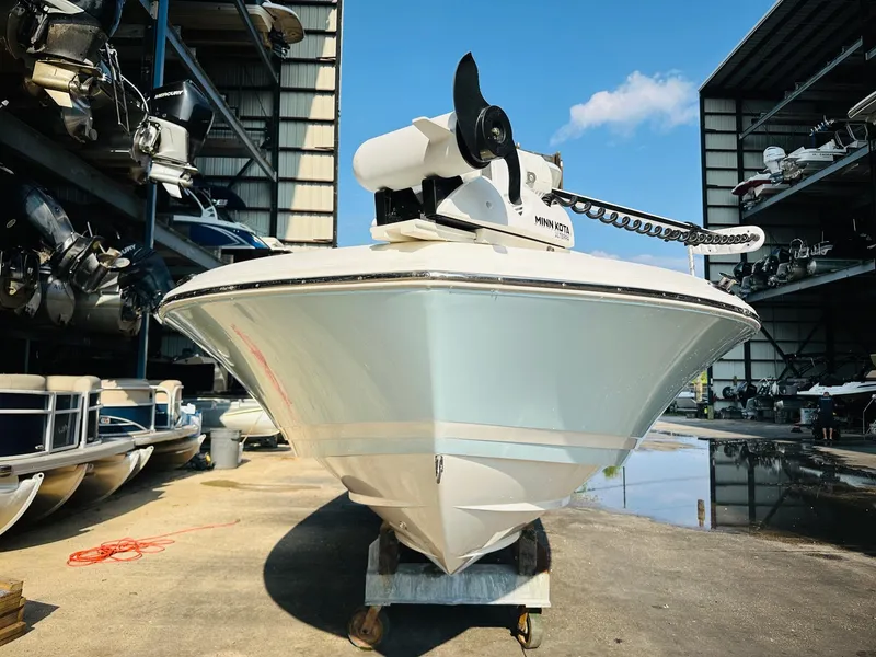 Slide: The Image of 2024 Caymas 281 HB boat in storage, featuring a sleek hull and modern design. - 4