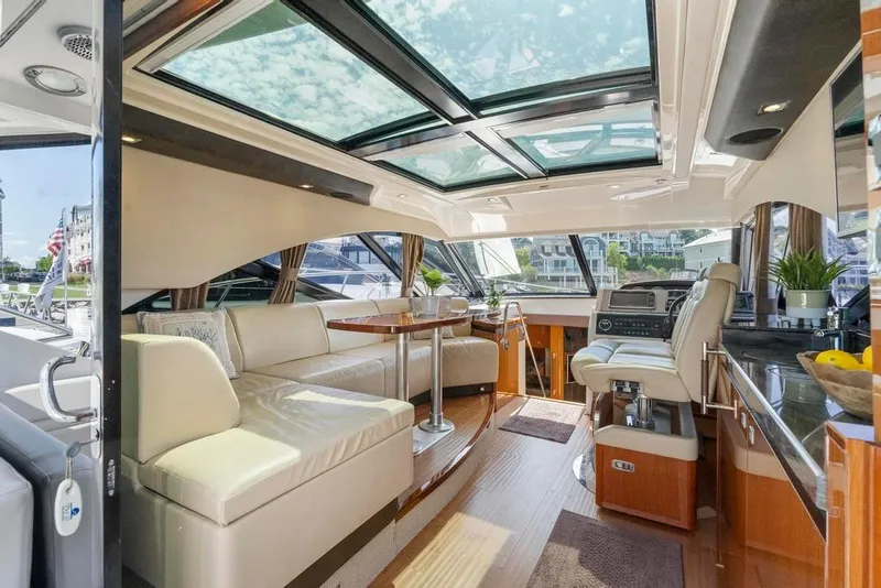 Slide: The Image of Luxurious interior of 2015 Sea Ray 510 Sundancer yacht with spacious seating and modern design. - 13