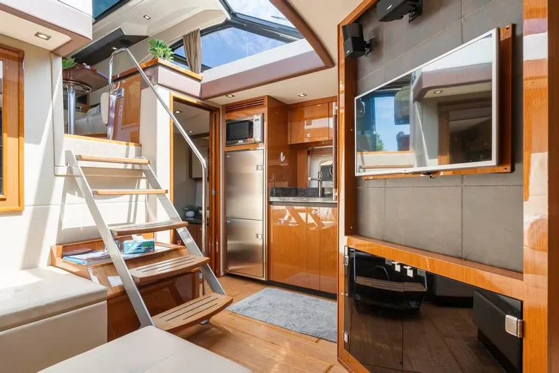 Slide: The Image of Luxurious interior of 2015 Sea Ray 510 Sundancer yacht with modern amenities and sleek design. - 21