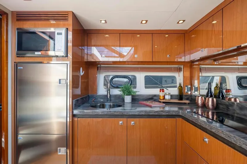 Slide: The Image of Luxurious kitchen interior of 2015 Sea Ray 510 Sundancer yacht with modern appliances. - 24