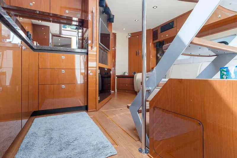 Slide: The Image of Interior of 2015 Sea Ray 510 Sundancer yacht with wooden cabinetry and modern design. - 25