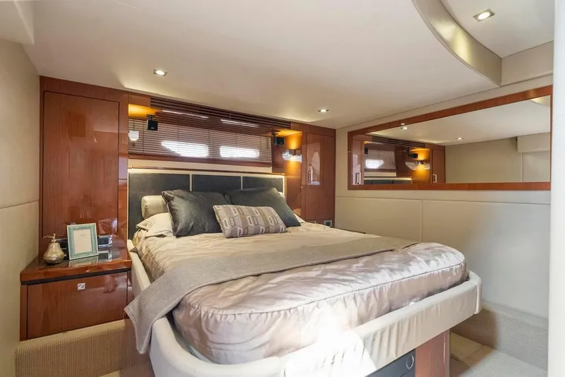 Slide: The Image of Luxurious bedroom interior of 2015 Sea Ray 510 Sundancer yacht with elegant wood finishes. - 27