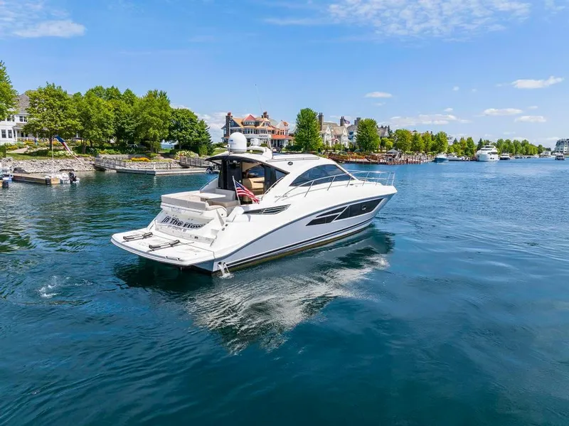 Slide: The Image of 2015 Sea Ray 510 Sundancer yacht cruising on a scenic waterway. - 4
