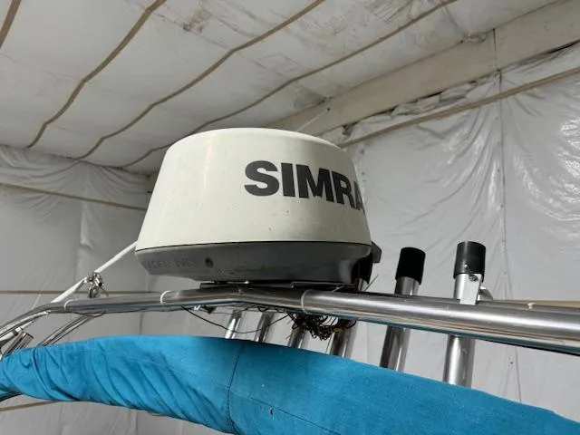 Slide: The Image of Radar equipment on a 1993 Rinker 280 Fiesta Vee boat, featuring Simrad technology. - 17