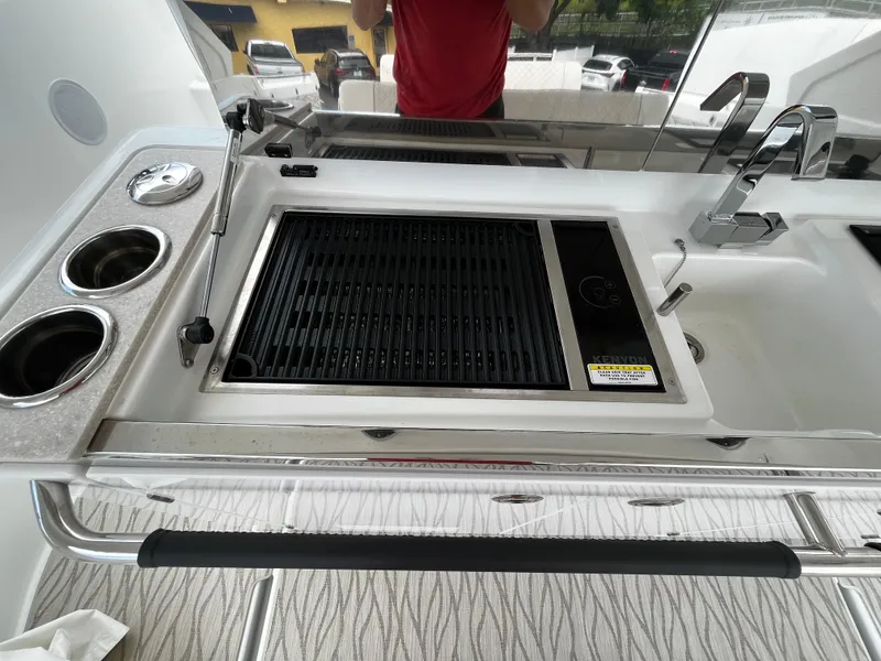 Slide: The Image of Outdoor kitchen on 2024 Jeanneau DB37 yacht with grill and sink. - 13