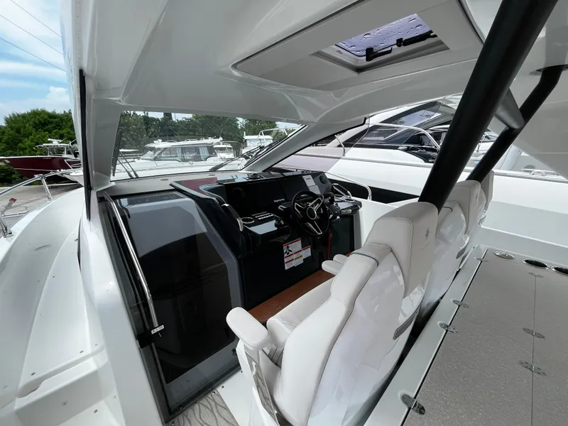 Slide: The Image of 2024 Jeanneau DB37 yacht cockpit with modern steering and seating. - 15