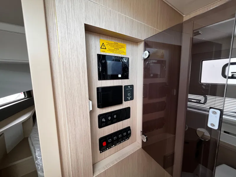 Slide: The Image of 2024 Jeanneau DB37 control panel with modern interface in cabin interior. - 22