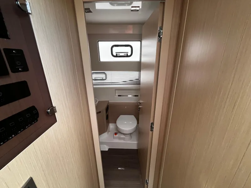 Slide: The Image of 2024 Jeanneau DB37 yacht bathroom with modern fixtures and wood paneling. - 23
