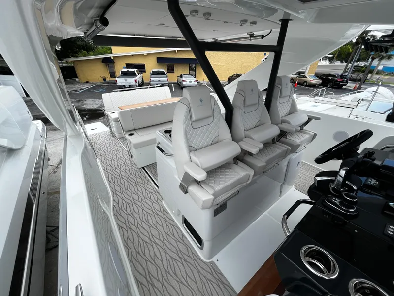 Slide: The Image of 2024 Jeanneau DB37 boat interior with luxurious seating and modern helm design. - 33