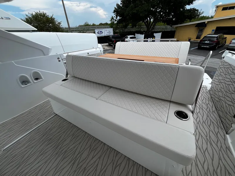 Slide: The Image of 2024 Jeanneau DB37 boat with elegant seating and modern design. - 8