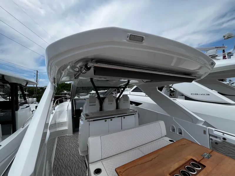 Slide: The Image of 2024 Jeanneau DB37 yacht interior with seating and table, showcasing modern design and luxury features. - 9