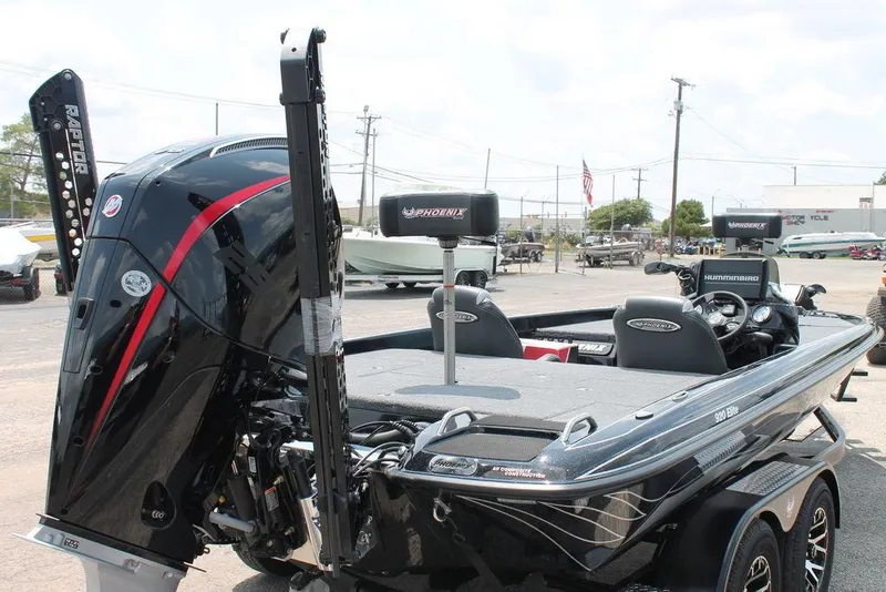 Slide: The Image of 2025 Phoenix 920 Elite boat with powerful engine, sleek design, and modern features. - 11