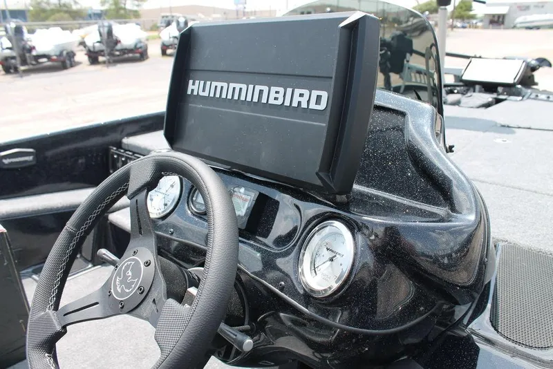Slide: The Image of Steering wheel and dashboard of 2025 Phoenix 920 Elite boat with Humminbird display. - 6