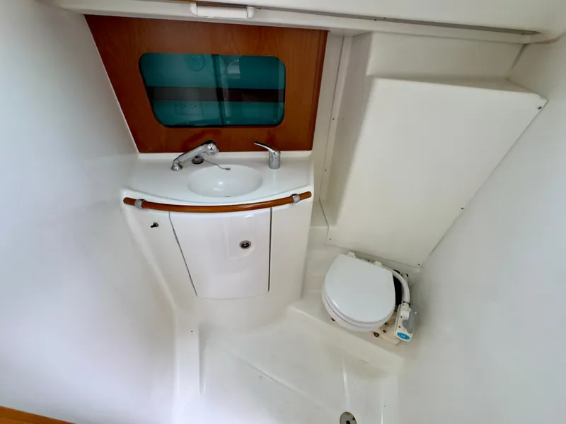 Slide: The Image of 2001 Beneteau Oceanis 331 bathroom with sink and toilet, compact and modern design. - 20