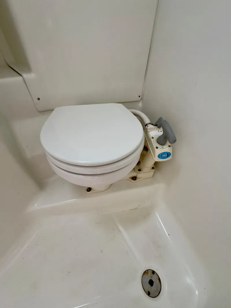 Slide: The Image of 2001 Beneteau Oceanis 331 marine toilet in white, compact and functional design. - 22
