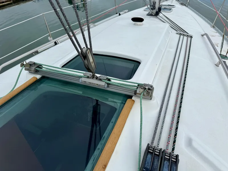 Slide: The Image of Deck view of 2001 Beneteau Oceanis 331 sailboat with rigging and hatch details. - 7