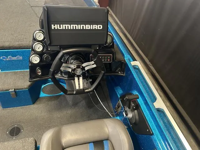 Slide: The Image of 2018 Bass Cat Lynx boat dashboard with Humminbird display and Mercury controls. - 10
