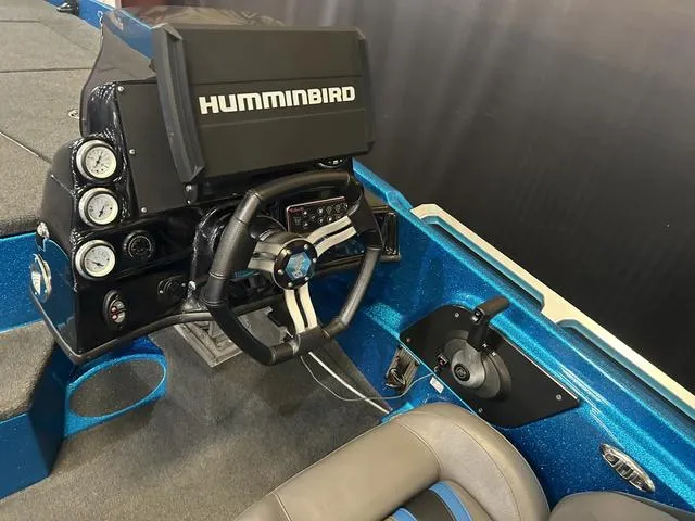 Slide: The Image of 2018 Bass Cat Lynx boat cockpit with Humminbird electronics and Mercury 250L controls. - 11