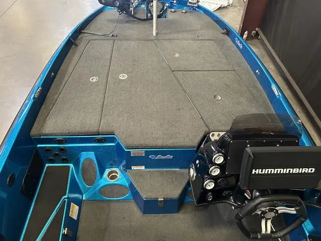 Slide: The Image of 2018 Bass Cat Lynx boat interior with Humminbird electronics and Mercury 250L engine. - 14