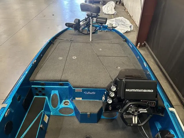 Slide: The Image of 2018 Bass Cat Lynx boat interior with Humminbird electronics and Mercury 250L engine. - 6