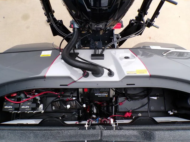 Slide: The Image of 2025 Skeeter ZXR21 boat engine compartment with visible wiring and components. - 13